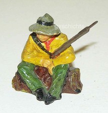 Wildwest-Mann, sitzt mit